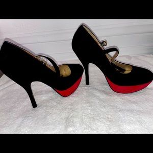 Slightly used size 10 women’s Black suede heel .
